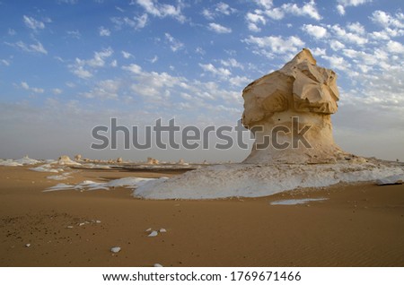 An outstanding scenery of a huge rock in the white desert of bahariya Oasis