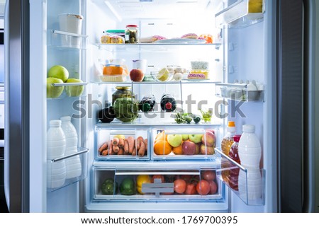 Open Refrigerator Or Fridge Door With Food Inside Royalty-Free Stock Photo #1769700395