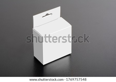 White box with hanger on dark ground, editable mock-up series template ready for your design, selection path included.