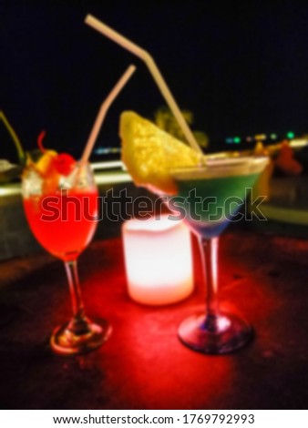 blurred cocktail or mock tail drinking on table