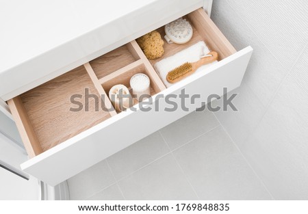 Open cosmetic and make up drawer organizer top view Royalty-Free Stock Photo #1769848835