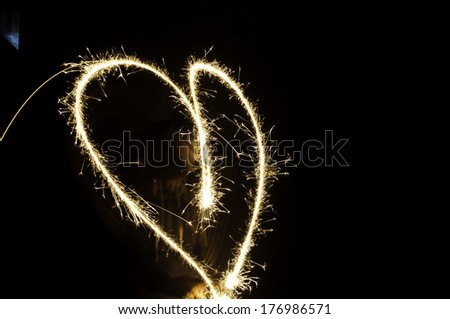 Sparkler heart on black background