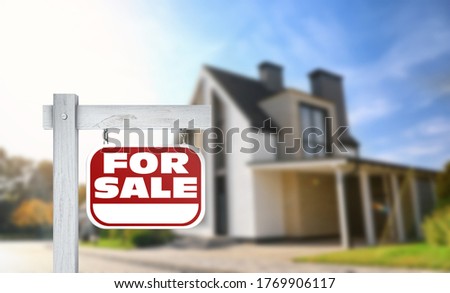 Red real estate sign with inscription FOR SALE near house outdoors on sunny day, space for text 