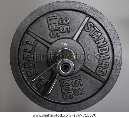 Thirty Five Pound Weight Plate With Clip Isolated Royalty-Free Stock Photo #1769915390