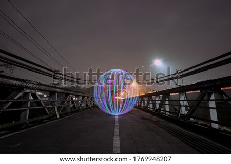 beautiful the ball of Light with red green blue color in the middle of the bridge