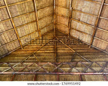 Background pictures of the house roof made of leaves and bamboo.