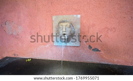 fountain with a stone face