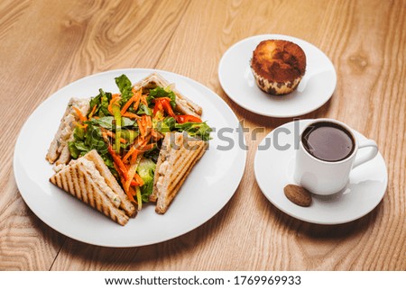 sandwiches and salad with a cup of coffee