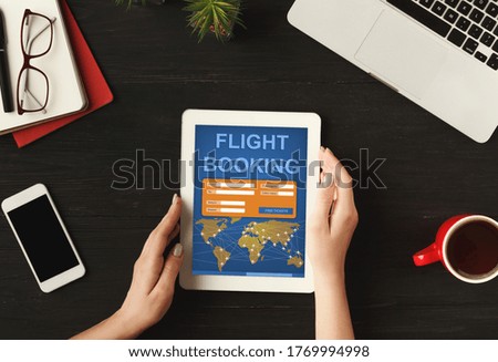 Unrecognizable Woman Booking Flight Tickets Online Using Digital Tablet Application Sitting At Workplace Indoors. Collage, Cropped, Top-View