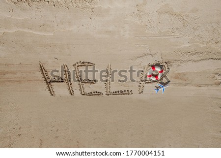 Help me the inscription on the sand. Please help me. On a tropical beach.