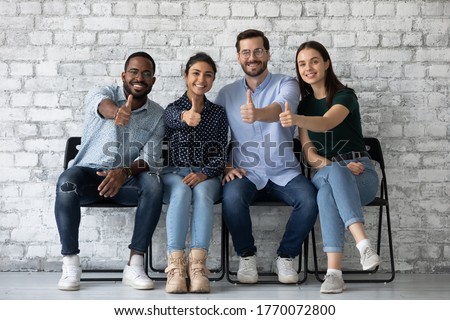Applicants new employees passed job interview getting position in company showing thumbs up. Corporate staff excellent working conditions, clients great qualified services recommend, positive feedback Royalty-Free Stock Photo #1770072800