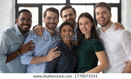 Portrait of diverse multi ethnic company staff, successful employees friendly associates standing in office photo shooting for business corporate album. Concept of hr, promotion advance, career growth