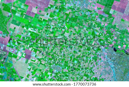 Satellite images in false-color compositions showing crops between the ash and wood boundaries California USA.