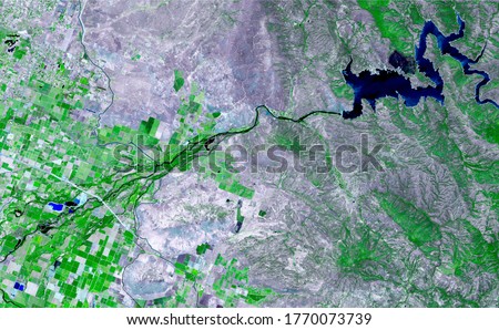 Satellite images in false-color compositions showing crops between the ash and wood boundaries California USA. Royalty-Free Stock Photo #1770073739