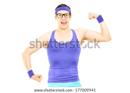 Nerdy man in sportswear showing bicep isolated on white background