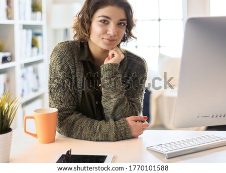 Student studying and learning online with a laptop in a desk at home