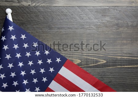 US flag with wood background copy space. American flag with space for text.