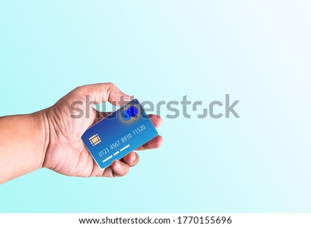 Hand holding credit card isolated on wifi technology. Security. New technology photo jpg