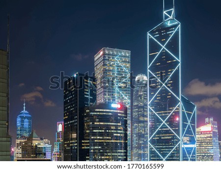 High rise modern office building in downtown district of Hong Kong city at night