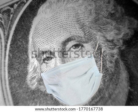 Coronavirus. Covid-19. George Washington wears his paper face mask to help stop the spread of the Coronavirus. One Dollar bill with George Washington wearing a Paper Face Mask. Covid-19 Pandemic. 
