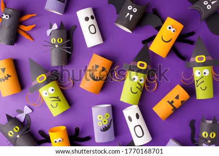 Halloween and decoration concept - monsters from toilet paper roll tube. Simple easy diy creative idea. Eco-friendly reuse recycle decor, kindergarten paper craft, seasonal holiday banner, flyer