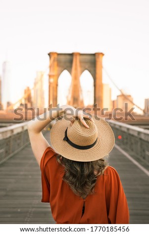 Fashion Photo of Woman at The Brooklyn Bridge in New York City at Sunrise