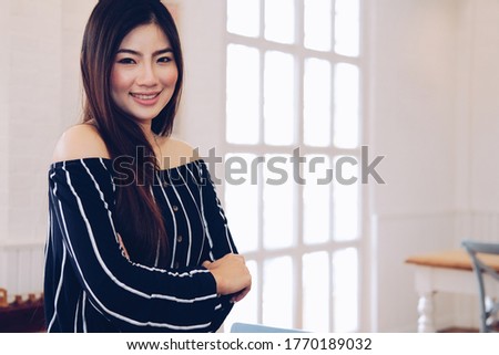 young asian woman smiling posing at home