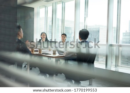 group of asian corporate executives meeting in conference room in office Royalty-Free Stock Photo #1770199553