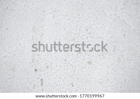 A white concrete background on a road in a no-parking area