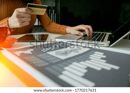 Business female working in office Sitting on a business trip Pay online