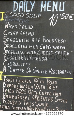 foreground of a  poster of the daily menu in a typical Spanish restaurant, Madrid, Spain.