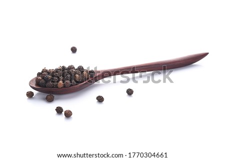 Close up black peper in wooden spoon pile on white background. Royalty-Free Stock Photo #1770304661
