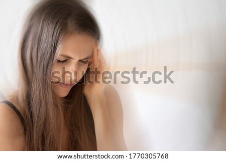 sick woman having headache, vertigo, dizziness symptoms Royalty-Free Stock Photo #1770305768