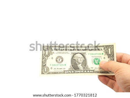 Top view a hand  holds one-dollar bills on a white background.