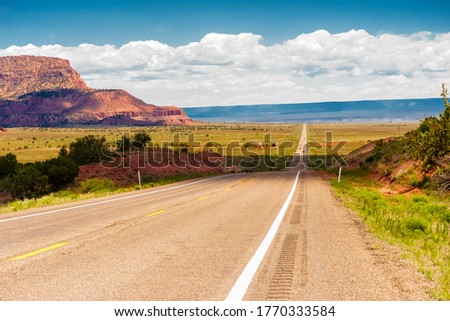 Amazing view of endless road, USA, on highway 66. Classic panorama view of historic U.S. Route 66 in beautiful light before sunset Royalty-Free Stock Photo #1770333584