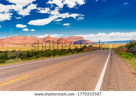 Amazing view of endless road, USA, on highway 66. Classic panorama view of historic U.S. Route 66 in beautiful light before sunset Royalty-Free Stock Photo #1770333587