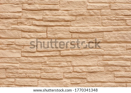 Beige stone wall, stone texture.