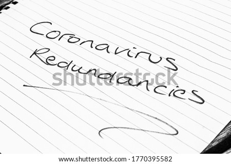 ‘Coronavirus Redundancies’ written on lined paper Royalty-Free Stock Photo #1770395582