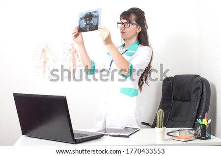 Dentist doctor watching x-ray picture orthopantomogram of jaw and teeth. Dentures, caries and pulpitis of wisdom teeth, background Royalty-Free Stock Photo #1770433553