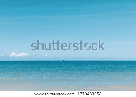 Beautiful tropical blue sky and sea in blue pastel tone.