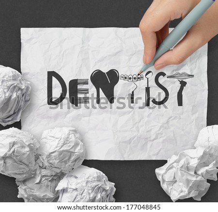 hand drawing design word  DENTIST on white crumpled paper and texture background as concept