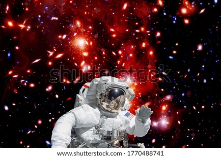 Astronaut against deep space. The elements of this image furnished by NASA.
