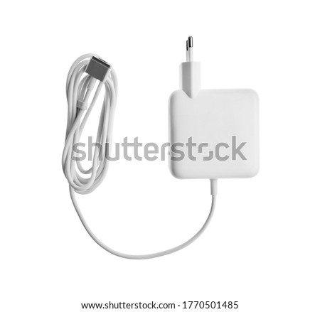Laptop charger isolated on white, top view. Modern technology