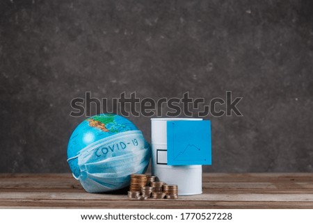  financial crisis of oil on the planet associated with the epidemic. globe with a bandage and a barrel of oil with a schedule