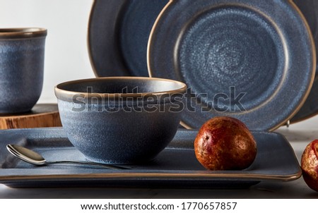Blue ancient pottery utensils and gourmet food
