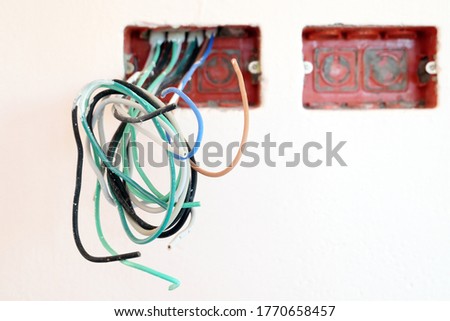 Power cables and outlet boxes in houses under construction