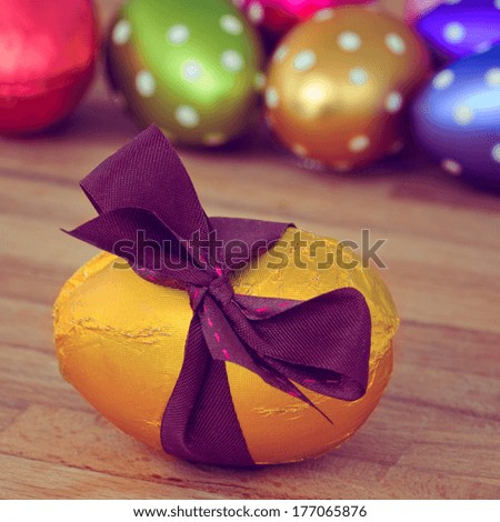 multicolored easter eggs on wooden table