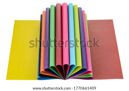 A set of colored paper isolated on a white background. Large selection of colors. The concept of a rainbow or flower. Crafts made of colored paper for children. Stationery. Abstract form.