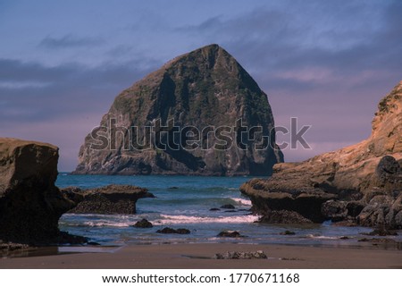 Haystack Rock ocean landscape in Cape Kiwanda State Natural Area in Pacific City on the Oregon Coast, Pacific Northwest United States Royalty-Free Stock Photo #1770671168