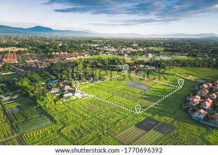 Land plot in aerial view. Gps registration survey of property, real estate for map with location, area. Concept for residential construction, development. Also home or house for sale, buy, investment. Royalty-Free Stock Photo #1770696392